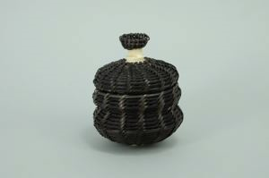 Image of small baleen basket with miniature oval baleen basket on ivory finial